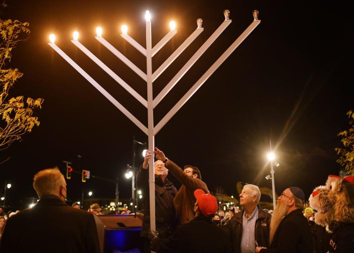 Bernie Rotman lights a light on the menorah. A Community Chanukah Party and Menorah Lighting was held at Polar Park, for the last night of Chanukah and sponsored by the Torah Center, Jewish Federation and the WooSox Sunday.