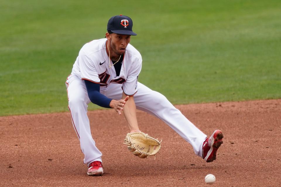 Minnesota Twins shortstop Andrelton Simmons (9) fields a ground ball from Atlanta Braves' Austin Riley in the third inning of a spring training baseball game Monday, March 22, 2021, in Fort Myers, Fla.