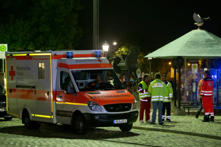 Emergency services pictured near the scene of the attack in Ansbach, southern Germany on July 24, 2016 that left dozens wounded