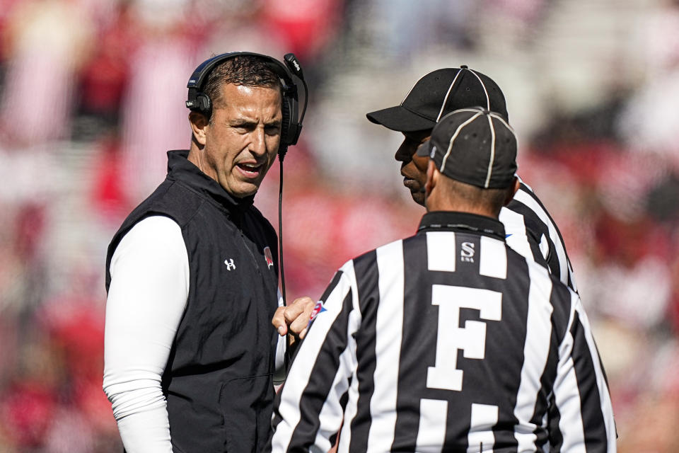 Wisconsin head coach Luke Fickell talks with officials during the second half of an NCAA college football game against Rutgers, Saturday, Oct. 7, 2023, in Madison, Wis. (AP Photo/Andy Manis)