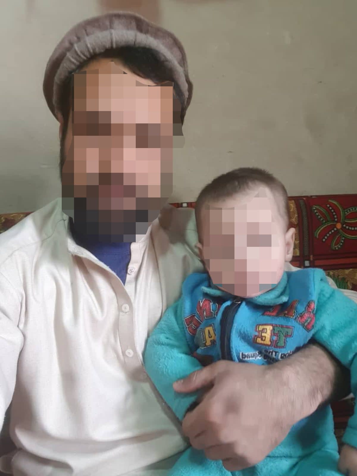 Relatives said 333 sniper Walid (left) was killed by the Taliban shortly after the fall of Kabul. His face, and that of his son, have been blurred to protect his family in Afghanistan. (Supplied)