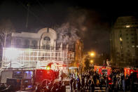 FILE - Smoke rises as Iranian protesters set fire to the Saudi embassy in Tehran, Sunday, Jan. 3, 2016. Iran and Saudi Arabia have agreed to reestablish diplomatic relations and reopen embassies after years of tensions. The two countries released a joint communique about the deal on Friday, March 10, 2023 with China, which apparently brokered the agreement. (Mohammadreza Nadimi/ISNA via AP, File)