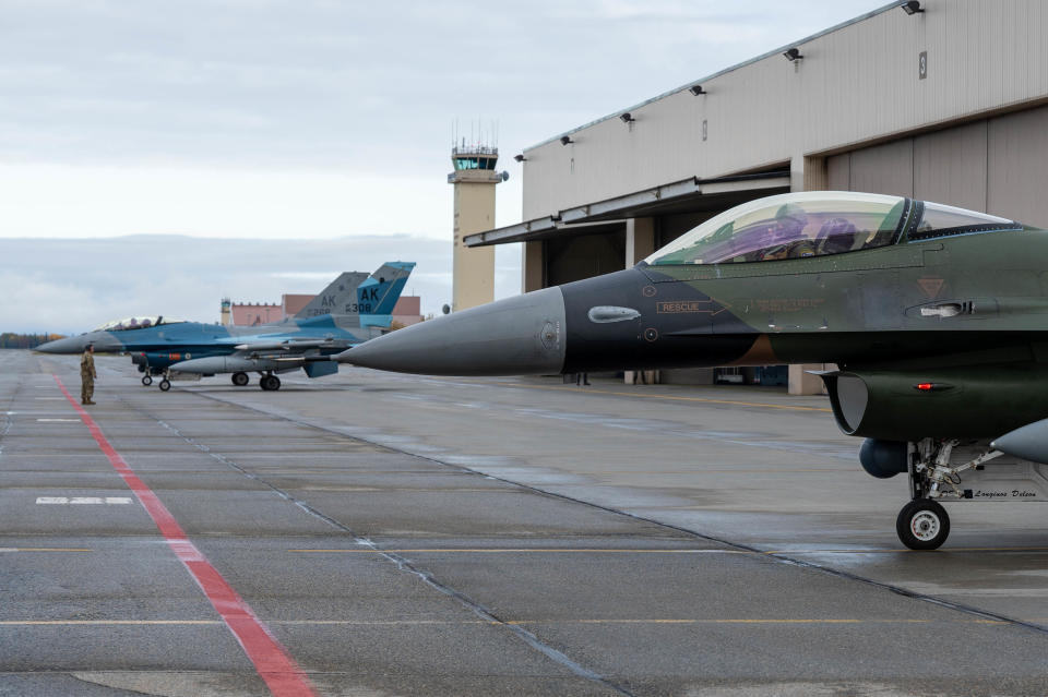 North American Aerospace Defense Command F-16 Fighting Falcons pilots perform final checks before departing Eielson Air Force Base, Alaska, on September 11, 2024. The F-16s supported OPERATION POLAR VORTEX and provided integration training with Navy assets in the Alaska Theater of Operations. Continuing our presence in the Arctic through training and operations demonstrates how NORAD and U.S. Northern Command conduct daily campaigns in coordination with mission partners to deter aggression; enhance deterrence, stability and resilience; advancement opportunities and attitude; and detect and respond to threats in support of the layered defense of our nations. (U.S. Air Force photo by Airman 1st Class Carson Jeney)