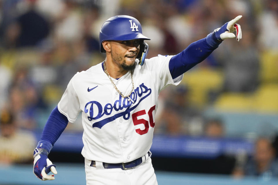 Los Angeles Dodgers' Mookie Betts celebrates after hitting a home run during the first inning of a baseball game against the San Diego Padres, Monday, Sept. 11, 2023, in Los Angeles. (AP Photo/Ryan Sun)