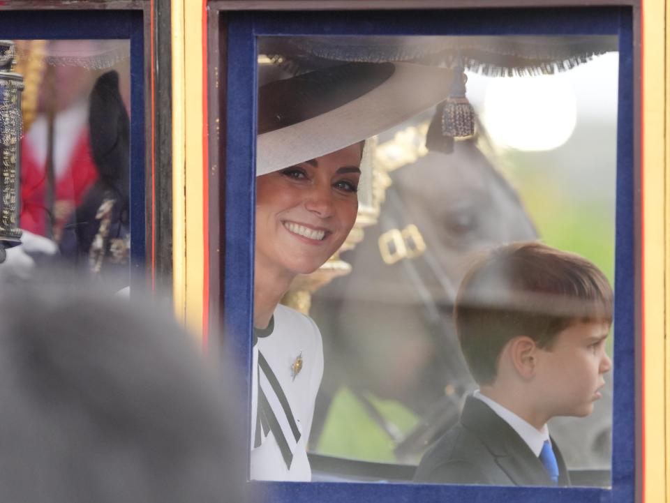 Kate smiling at the crowds while travelling along The Mall (Jonathan Brady/PA Wire)