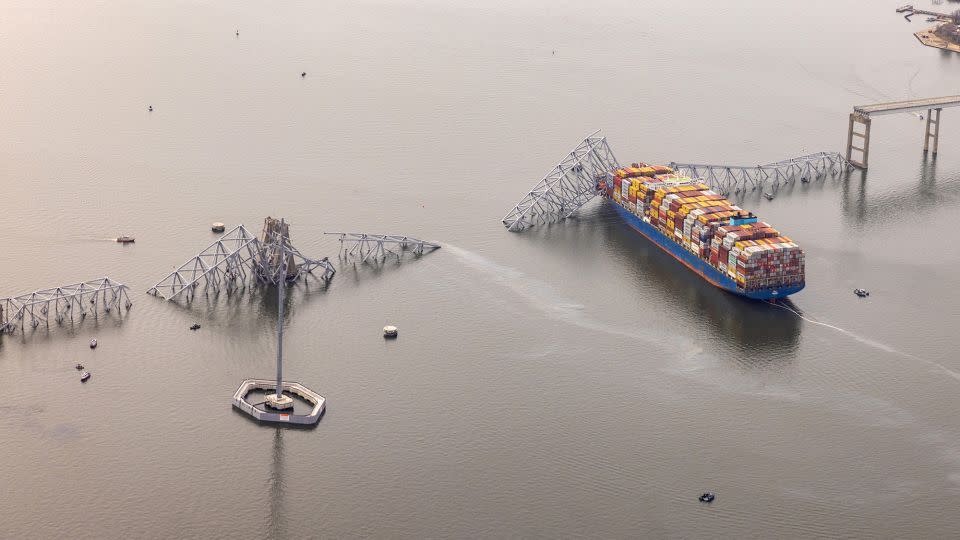 Pieces of the Francis Scott Key Bridge are draped over the cargo ship Dali on Tuesday. - Tasos Katopodis/Getty Images