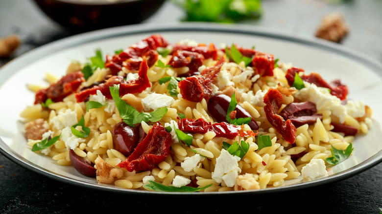 Dehydrated tomatoes with orzo and olives