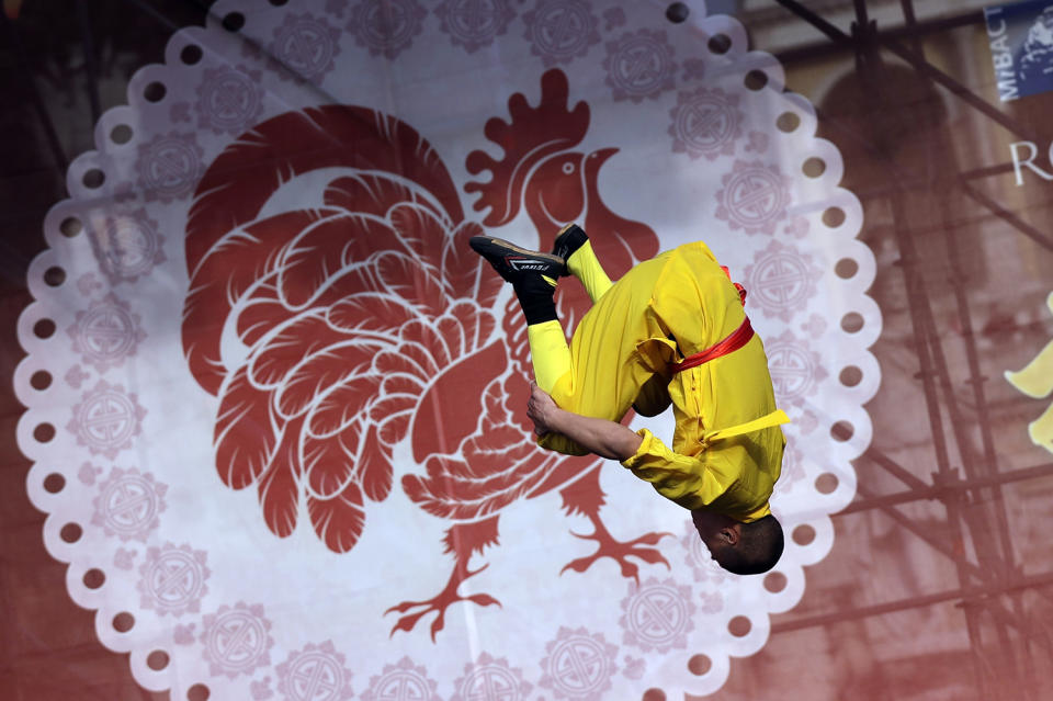 An artist performs during the Lunar parade through the center of Rome to mark Chinese new year, in Rome, Saturday, Jan. 28, 2017. (AP Photo/Alessandra Tarantino)