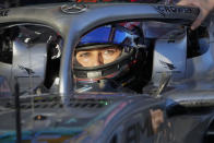 Mercedes driver George Russell of Britain sits in his car in pit lane during qualifying for the Australian Formula One Grand Prix in Melbourne, Australia, Saturday, April 9, 2022. (Simon Baker, Pool via AP)