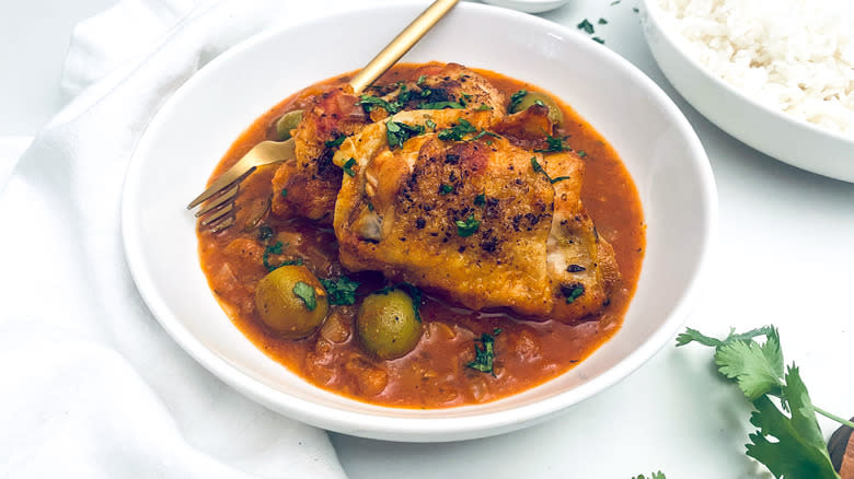 chicken fricassee in bowl with rice