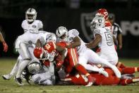 Oct 19, 2017; Oakland, CA, USA; Kansas City Chiefs running back Kareem Hunt (27) is tackled by Oakland Raiders linebacker Nicholas Morrow (50) in the fourth quarter at Oakland Coliseum. The Raiders defeated the Chiefs 31-30. Mandatory Credit: Cary Edmondson-USA TODAY Sports