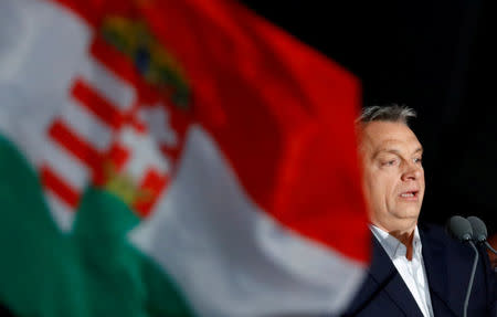 FILE PHOTO: Hungarian Prime Minister Viktor Orban addresses the supporters after the announcement of the partial results of parliamentary election in Budapest, Hungary, April 8, 2018. REUTERS/Leonhard Foeger/File Photo