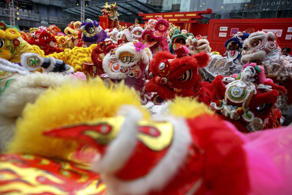 Lion and dragon dancers perform as part of the festive Chinese New Year celebrations in Bangkok's shopping district