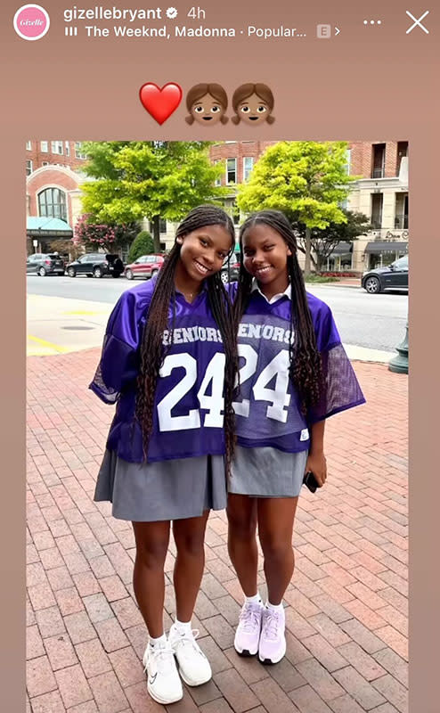 Angel Bryant and Adore Bryant in matching purple jerseys and grey skirts outdoors.