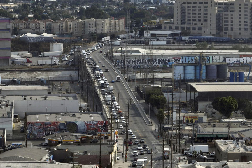In this aerial view, traffic is backed up near a closed interstate 10 in the aftermath of a fire, Monday, Nov. 13, 2023, in Los Angeles. Los Angeles drivers are being tested in their first commute since a weekend fire that closed a major elevated interstate near downtown. (AP Photo/Jae C. Hong)
