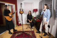 Members of the folk group The Staves, from left, sisters, Jessica, Emily and Camilla Staveley-Taylor appear in a north London recording studio, on Feb. 15, 2021. The Staves released their third album, “Good Woman,” last month. (Photo by Joel C Ryan/Invision/AP)