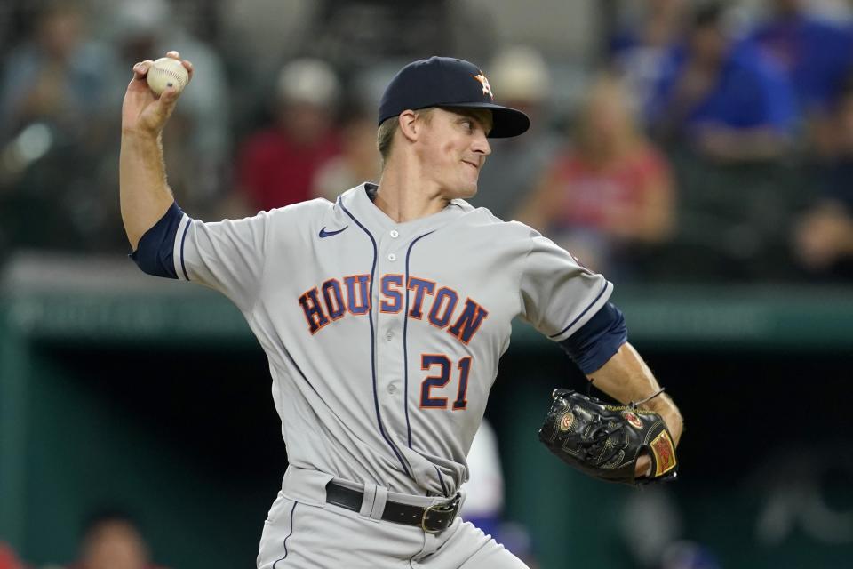 Houston Astros starting pitcher Zack Greinke throws during the first inning of the team's baseball game against the Texas Rangers in Arlington, Texas, Tuesday, Sept. 14, 2021. (AP Photo/Tony Gutierrez)