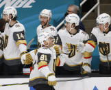 Vegas Golden Knights center Jonathan Marchessault (81) celebrates with the bench after scoring a goal against the San Jose Sharks during the first period of an NHL hockey game in San Jose, Calif., Saturday, Feb. 13, 2021. (AP Photo/Josie Lepe)