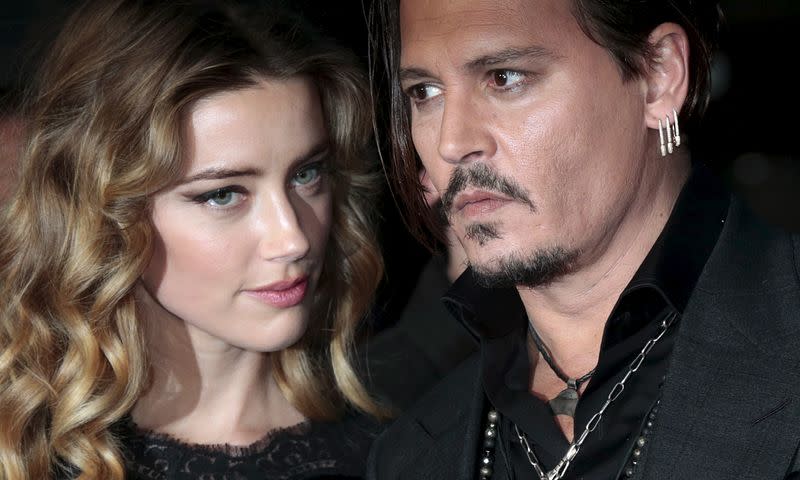 Cast member Johnny Depp and his actress wife Amber Heard arrive for the British premiere of the film "Black Mass" in London