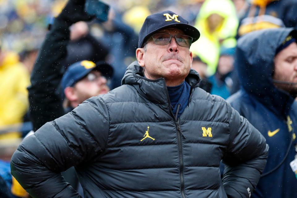 Michigan coach Jim Harbaugh watches the second half of the Wolverines' 52-7 win over Indiana.