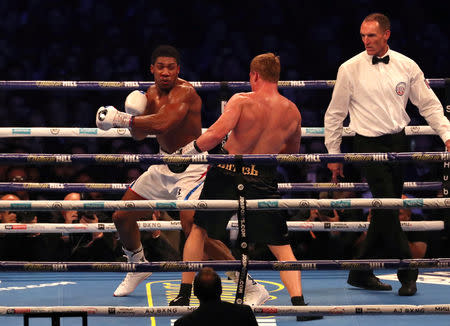 Boxing - Anthony Joshua v Alexander Povetkin - WBA Super, IBF, WBO & IBO World Heavyweight Titles - Wembley Stadium, London, Britain - September 22, 2018 Anthony Joshua in action against Alexander Povetkin Action Images via Reuters/Peter Cziborra