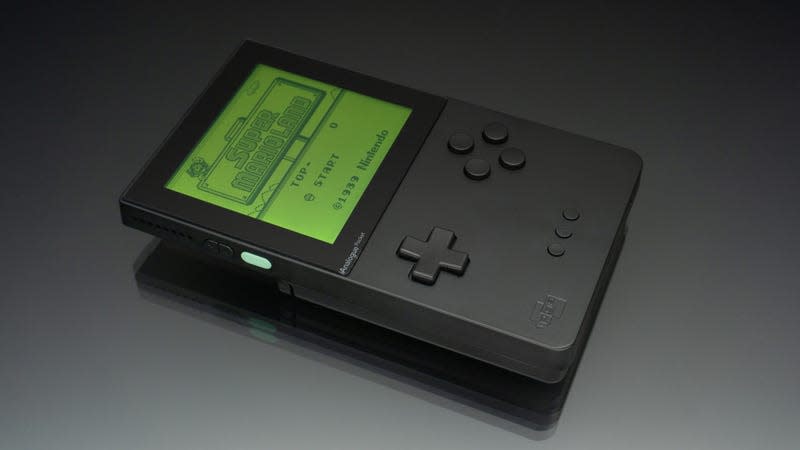 The black version of the Analogue Pocket, with Super Mario Land on the screen, against a black backdrop.