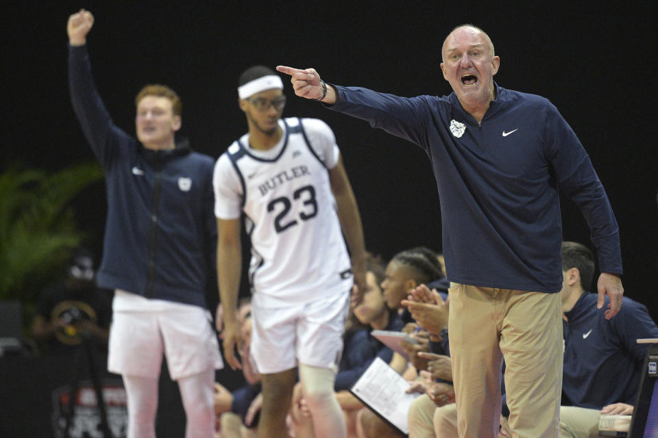 Butler head coach Thad Matta, right, argues for a call with an official during the first half of an NCAA college basketball game against Florida Atlantic, Thursday, Nov. 23, 2023, in Kissimmee, Fla. (AP Photo/Phelan M. Ebenhack)