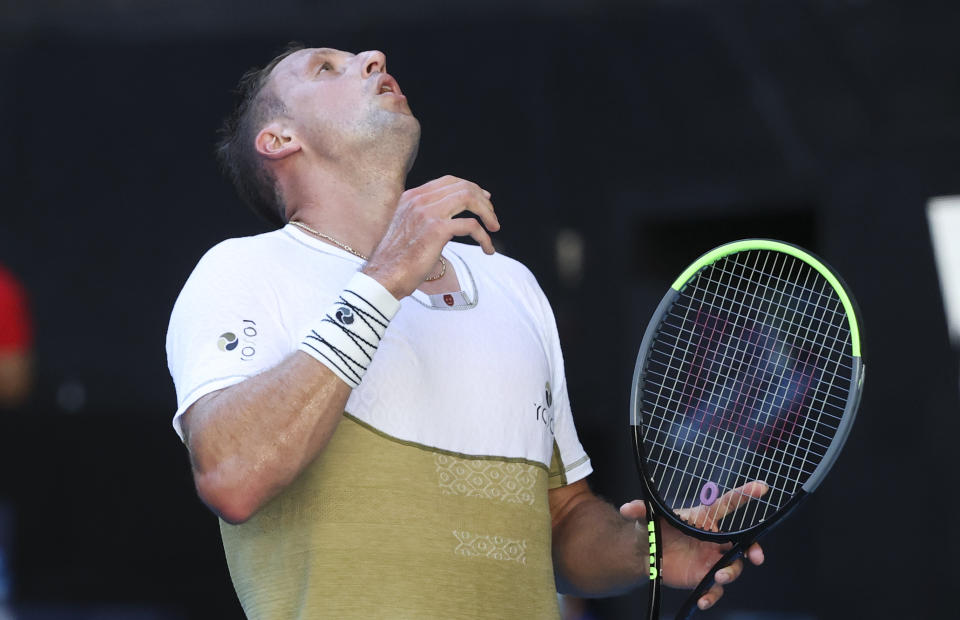 United States' Tennys Sandgren reacts during his match against Australia's Alex De Minaur during their first round match at the Australian Open tennis championship in Melbourne, Australia, Tuesday, Feb. 9, 2021.(AP Photo/Hamish Blair)