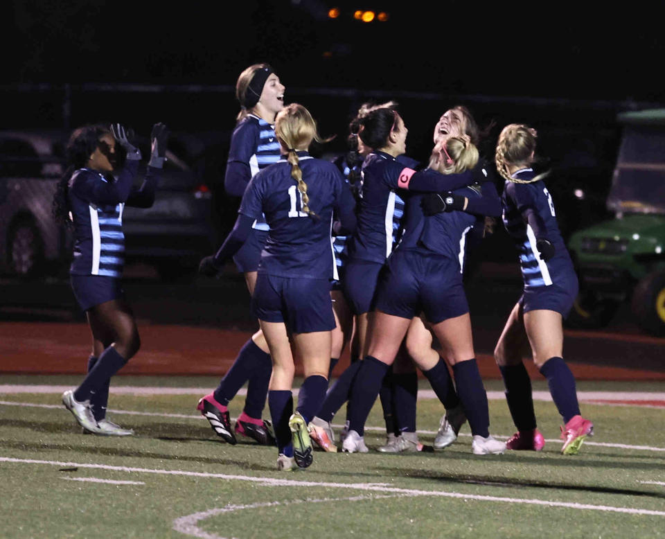 Mount Notre Dame players celebrate after a goal during their soccer game against Milford Tuesday, Oct. 31, 2023.