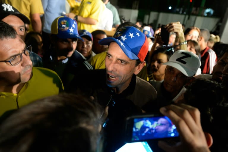 Venezuelan opposition leader Henrique Capriles (C) told the media in Caracas "If the dictatorship is squealing, it is a sign that we are making progress"