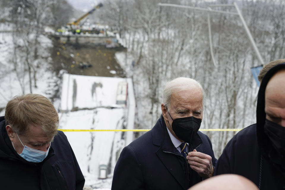 FILE - President Joe Biden visits the site where the Fern Hollow Bridge collapsed Jan. 28, 2022, in Pittsburgh's East End. The Fern Hollow Bridge became a symbol of the country's troubled infrastructure, collapsing into a ravine earlier this year just before President Joe Biden visited the city. Biden hopes to turn the bridge into a symbol of success for his administration when he returns to Pittsburgh on Thursday, Oct. 20, less than three weeks before the midterm elections. (AP Photo/Andrew Harnik, File)