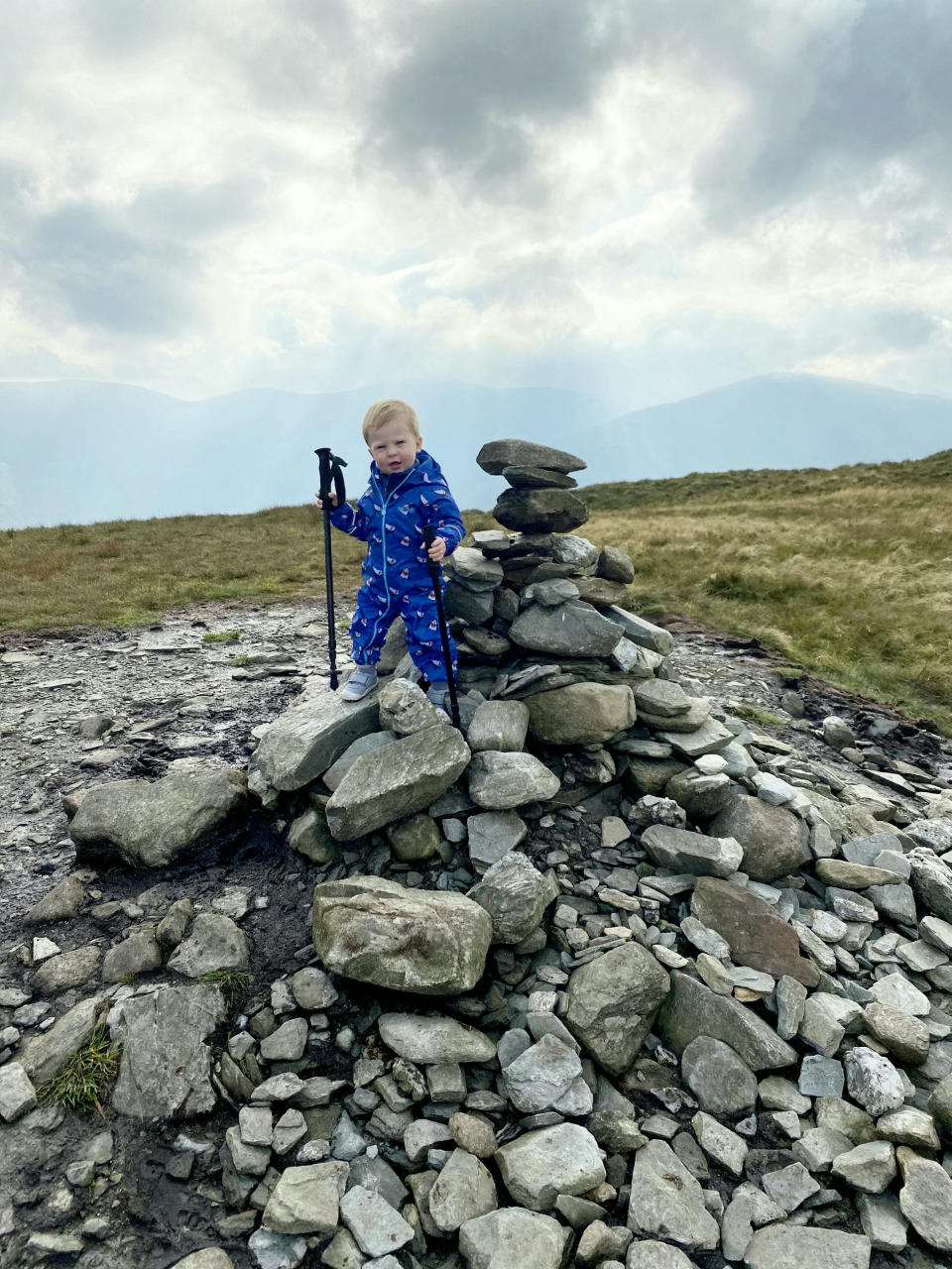 A baby was on top of the world as he tottered around a mountain summit. Little Joel Russell, 18 months, was carried up the top of Beinn Dubh, near Helensburgh, Argyll and Bute, by his dad, Kyle, 27. The tot, who has been walking since he was a year old, was given walking poles which Kyle made small enough for him to use. Dad-of-two Kyle said: "He was saying 'where are we going, where are we going?'."