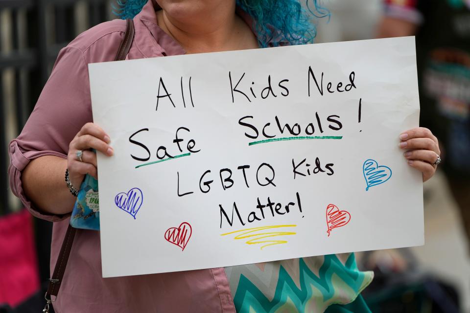 Gwendolyn DeRosa of Victorian Village and LGBTQ+ allies protest outside the Ohio Department of Education building as the board hears public testimony on a resolution that opposes proposed changes to Title IX.