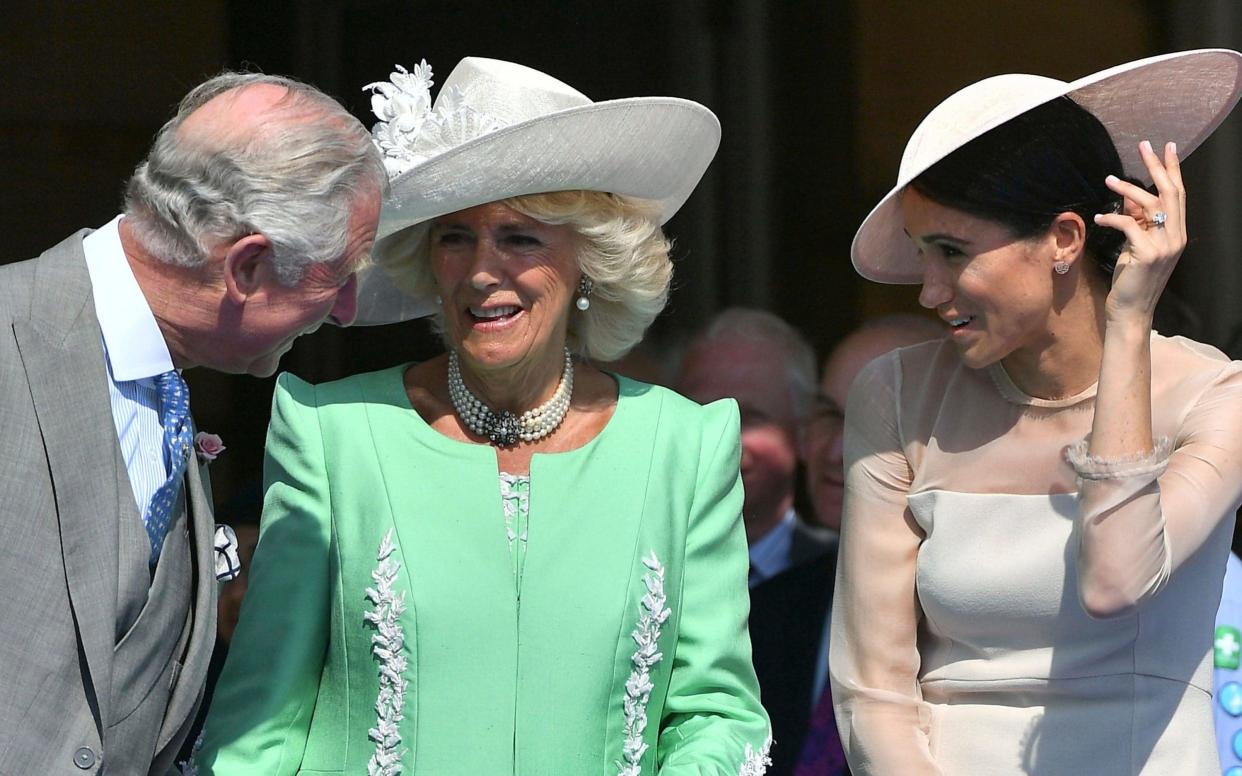 Prince Charles, with wife Camilla, the Duchess of Cornwal, and the Duchess of Sussex - Pool PA
