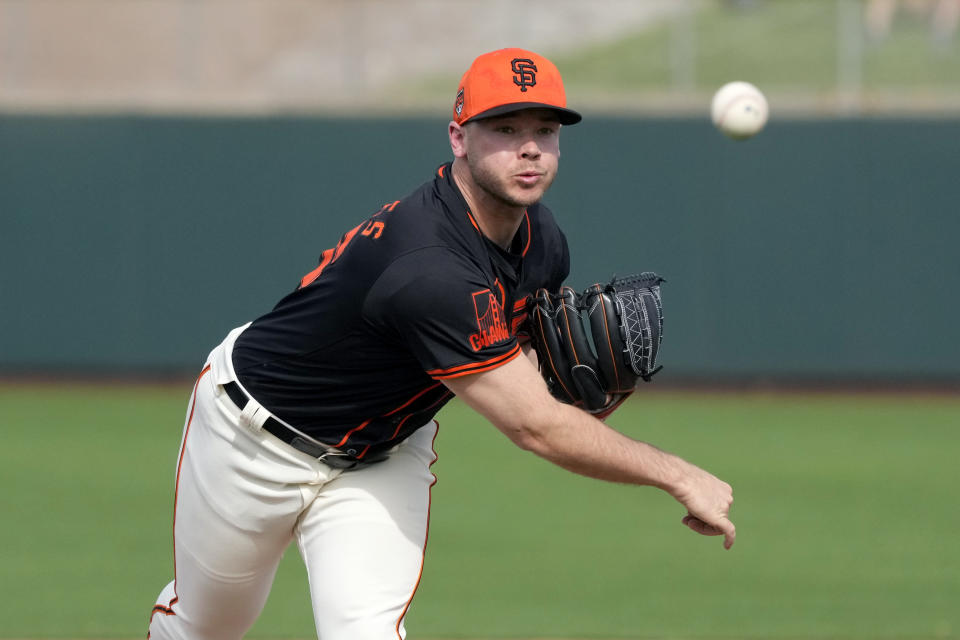 San Francisco Giants pitcher Daulton Jefferies warms up during the fifth inning of a spring training baseball game against the Seattle Mariners Tuesday, Feb. 27, 2024, in Scottsdale, Ariz. Jefferies is trying to come back from a second Tommy John surgery at age 28. (AP Photo/Ross D. Franklin)