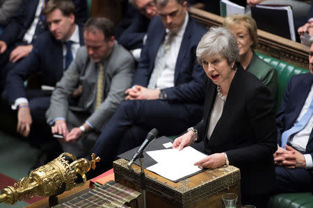 Prime Minister Theresa May talks about Brexit 'plan B' in Parliament, in London, Britain, January 29, 2019. Text in documents removed at source. UK Parliament/Jessica Taylor/Handout via REUTERS