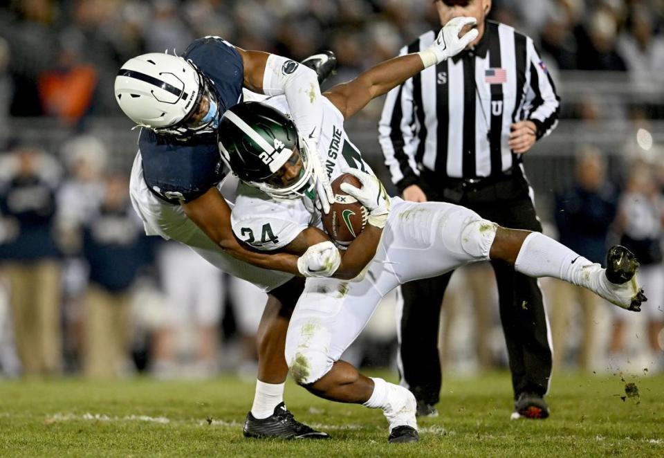 Penn State safety Ji’Ayir Brown stops Michigan State’s ball carrier Elijah Collins during the game on Saturday, Nov. 26, 2022.