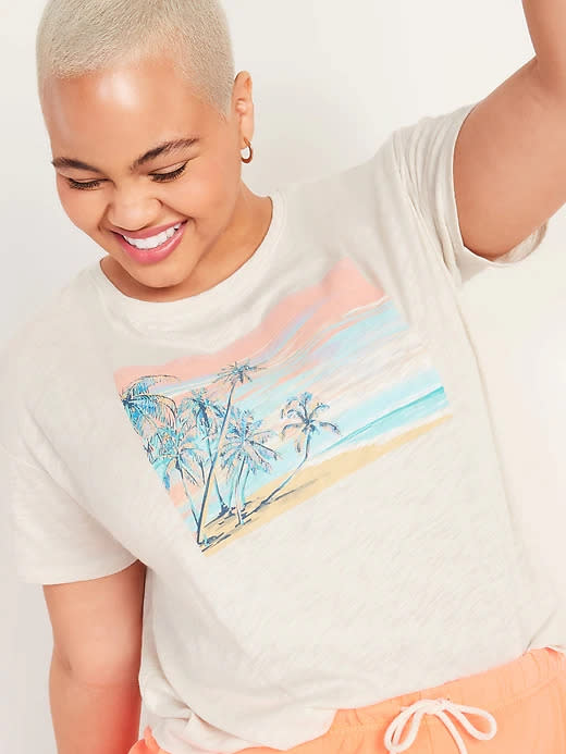 Model wears Loose Graphic Easy Short-Sleeve T-Shirt with palm tree graphic design. Image via Old Navy.