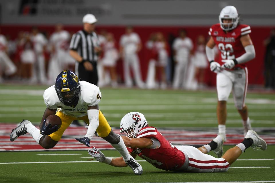 USD's Stephen Hillis (34) tackles a Murray State player on Saturday, Oct. 7, 2023 at Dakota Dome in Vermillion, South Dakota .