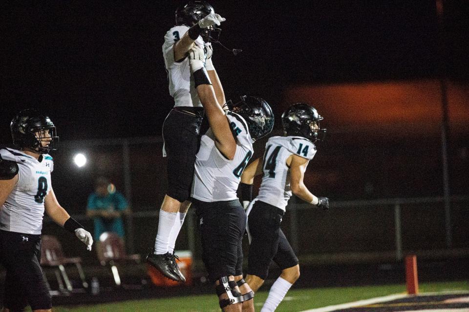 Cayden Daugherty of Gulf Coast celebrates a touchdown against Immokalee during the Class 4S-Region 4 quarterfinal at Immokalee on Friday, Nov. 10, 2023. Immokalee won on a last second touchdown to win 37-0.