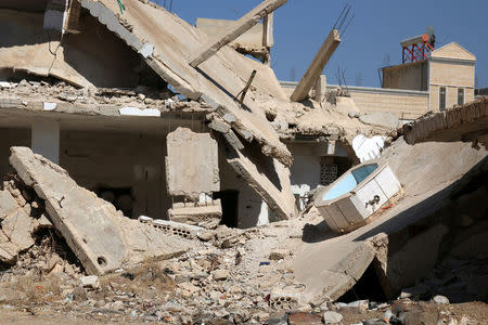 A general view shows damaged buildings in the rebel-held town of Dael, in Deraa Governorate, Syria July 7, 2016. REUTERS/Alaa Al-Faqir