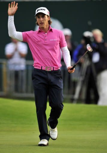 Thorbjorn Olesen of Denmark reacts after making a birdie putt on the 18th green during his second round of the 2012 British Open Golf Championship at Royal Lytham and St Annes in England. Olesen birdied the last two holes to stand fourth on 135, booking himself a Saturday penultimate pairing with Woods