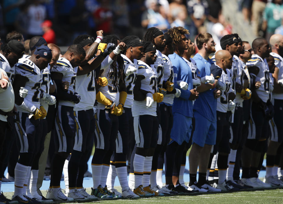 <p>Members of the Los Angeles Chargers link arms during the national anthem before an NFL football game against the Kansas City Chiefs, Sunday, Sept. 24, 2017, in Carson, Calif. (AP Photo/Jae C. Hong) </p>