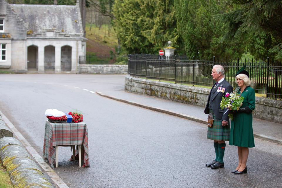 Britain's Prince Charles, Prince of Wales (L) and Britain's Camilla, Duchess of Cornwall (R) observe a 2 minute silence to mark the 75th anniversary of VE Day (Victory in Europe Day), the end of the Second World War in Europe at the Balmoral War Memorial in central Scotland on May 8, 2020. (Photo by Amy Muir / POOL / AFP) (Photo by AMY MUIR/POOL/AFP via Getty Images)