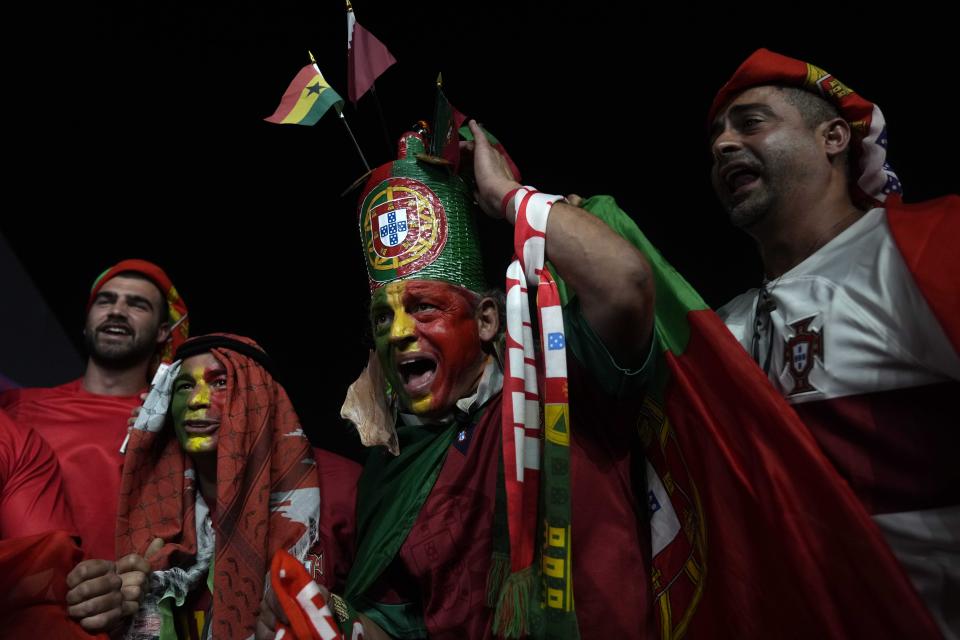 Portugal fans cheer prior to the World Cup group H soccer match between Portugal and Ghana, at the Stadium 974 in Doha, Qatar, Thursday, Nov. 24, 2022. (AP Photo/Francisco Seco)