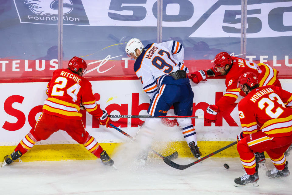 Connor McDavid and the Edmonton Oilers played the Calgary Flames hours after a memorial service for teammate Colby Cave.