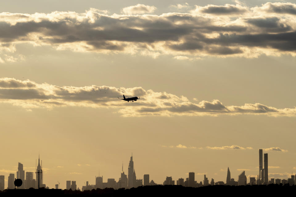 A JetBlue airplane lands at John F. Kennedy International Airport ahead of the Fourth of July holiday weekend on Tuesday, June 28, 2022, in New York. (AP Photo/Julia Nikhinson)