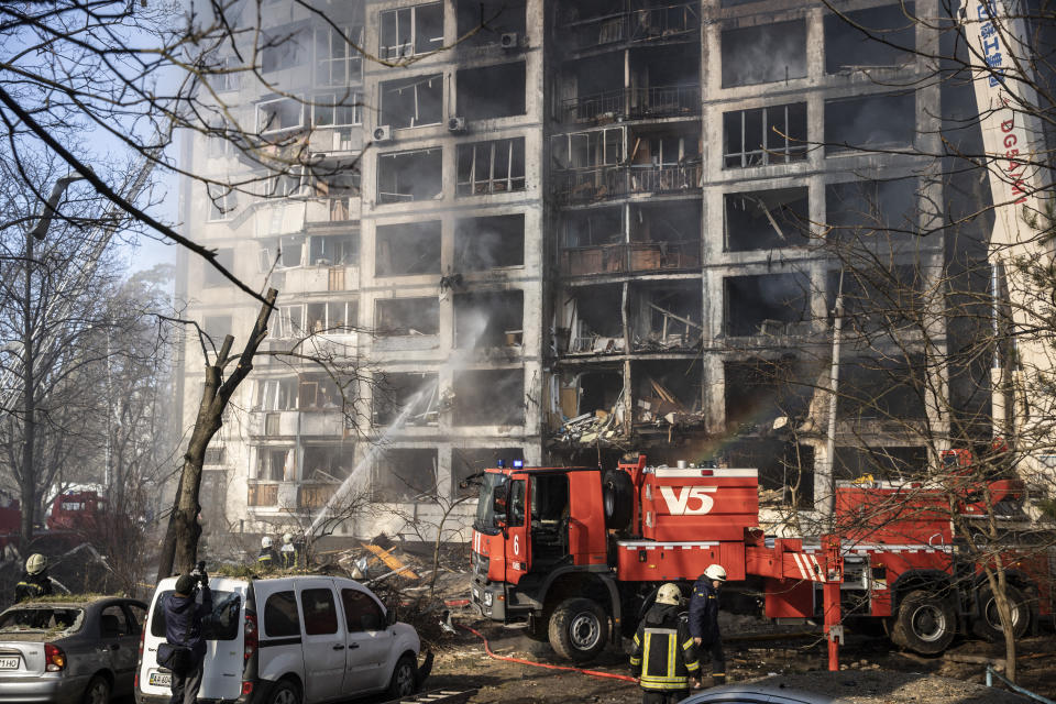 KYIV, UKRAINE - MARCH 15: Firefighters extinguish fire at a damaged residential building that was hit by a Russian attack in Kyiv, Ukraine on March 15, 2022. (Photo by Emin Sansar/Anadolu Agency via Getty Images)