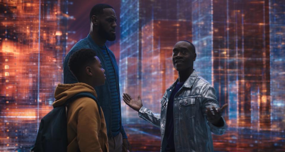 (L-R) Dom James (Cedric Joe) and his famous father LeBron James are pulled into the "server-verse" by Al G. Rhythm (Don Cheadle).