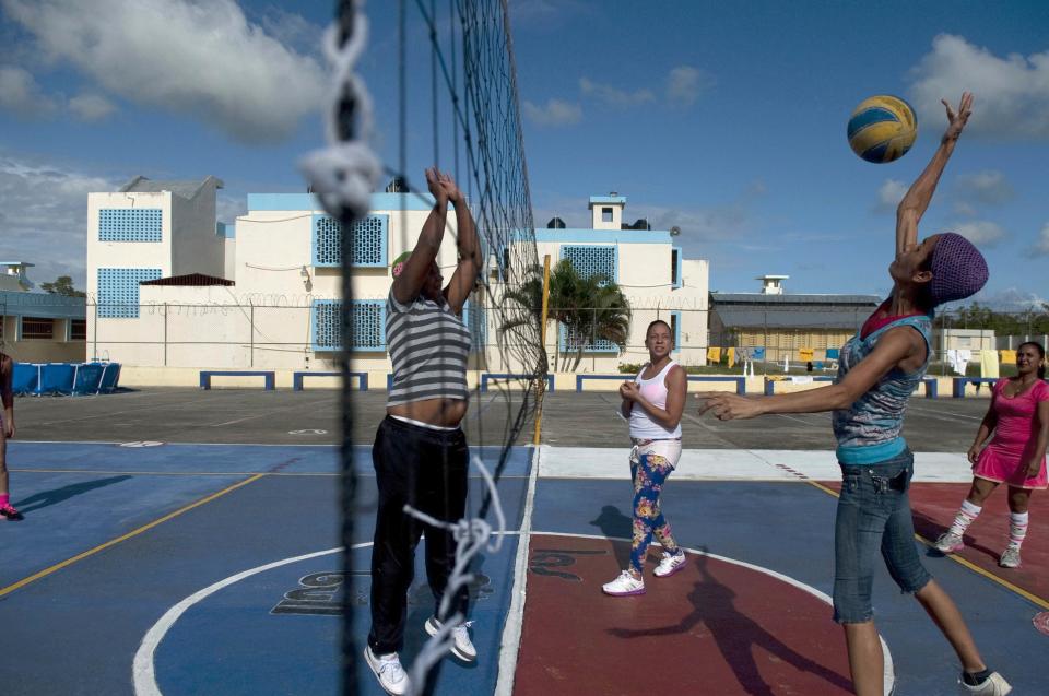 Prisoners play volleyball in the yard of the renovated wing of the Najayo Women's prison in San Cristobal